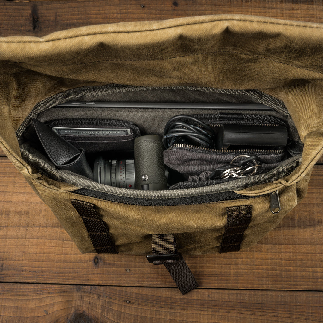 Wotancraft Pilot 7L khaki bag open from above with Leica camera and accessories