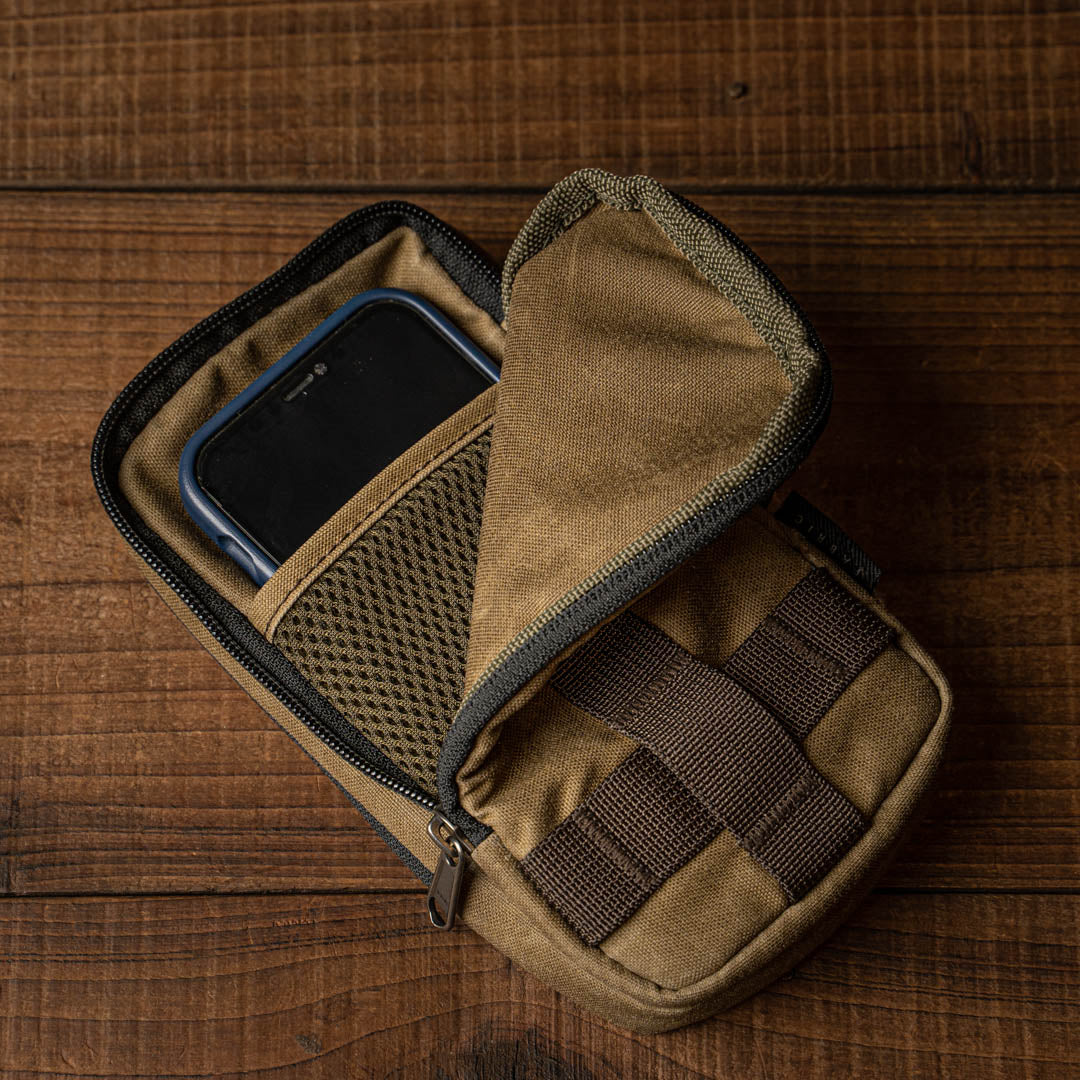 Wotancraft khaki zipper pouch open with a phone inside