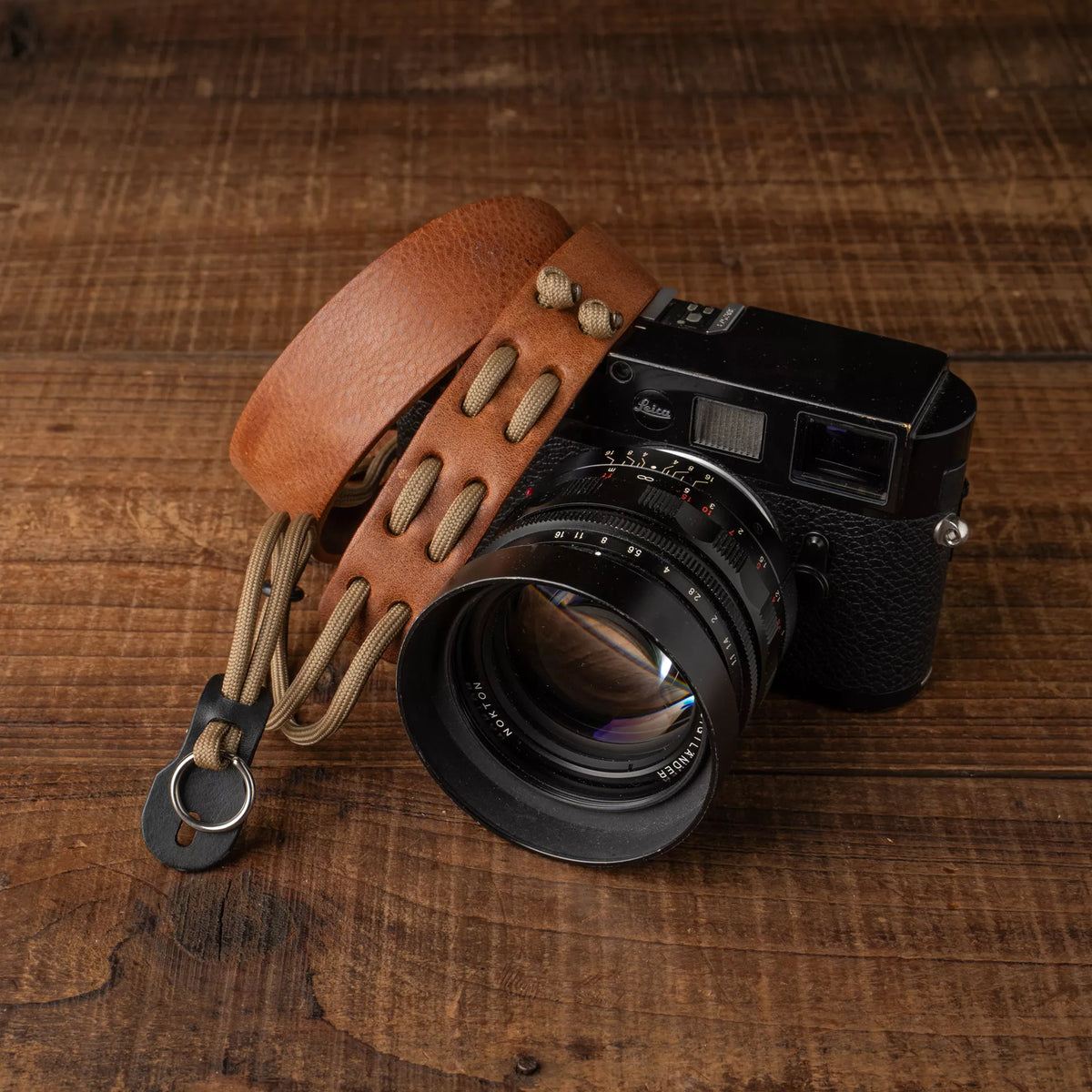 Wotancraft Parashooter Style 3 tan leather strap on a black Leica with Nokton lens
