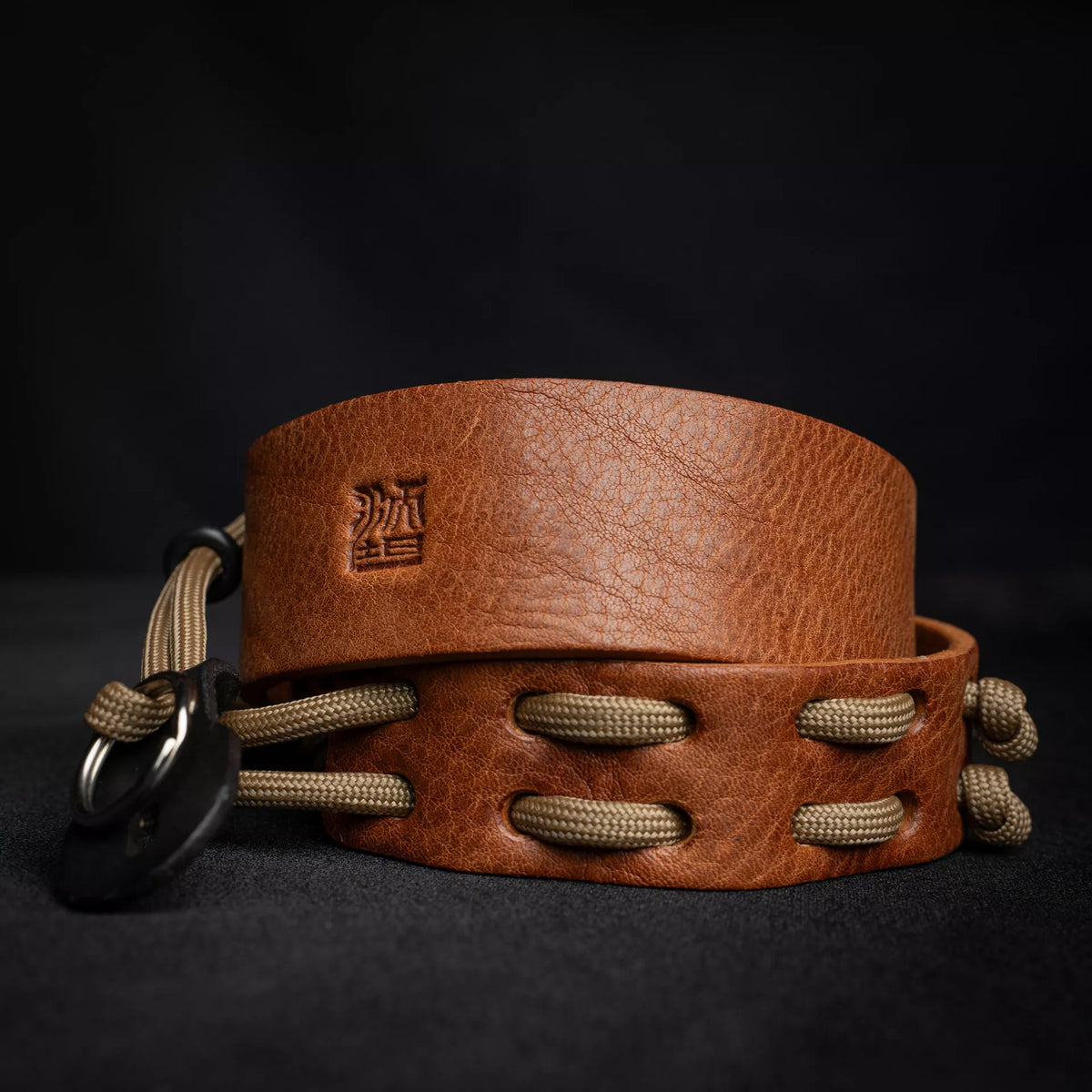 Wotancraft Parashooter Style 3 tan leather camera strap with paracord, coiled