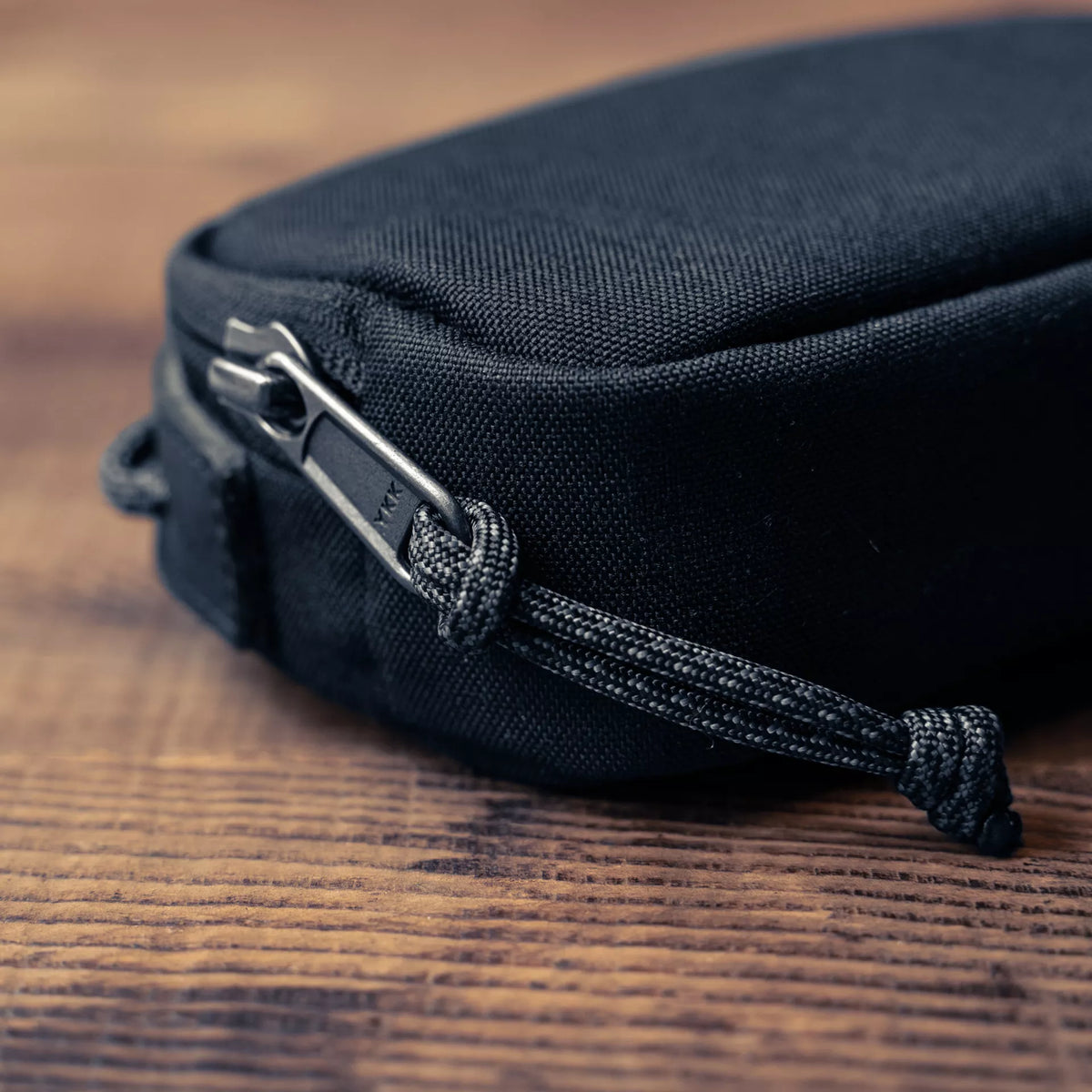 Wotancraft small black canvas pouch zip pull with paracord close-up