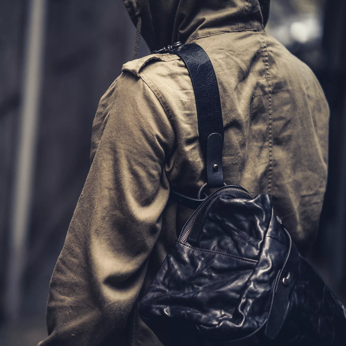 Wotancraft Lightning Rider black leather bag worn over the shoulder, close-up