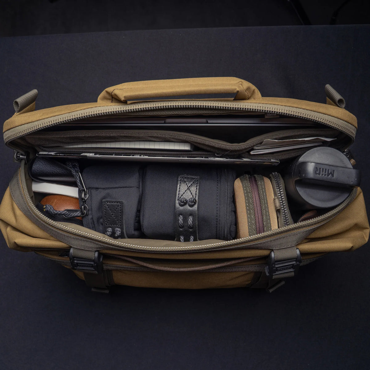 Wotancraft Lightning Rider v2 khaki bag open with laptop, camera pouches and bottle