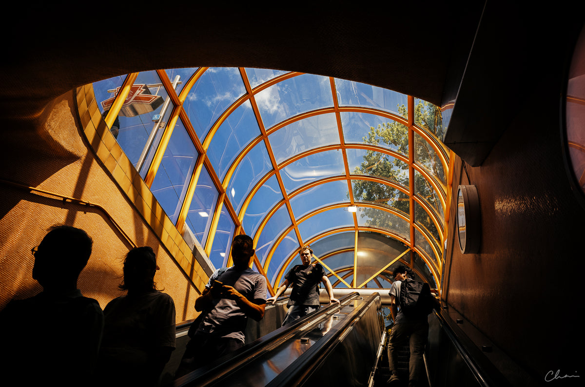 Escalator under a glass dome on a sunny day, sample photo from the Thypoch Eureka 28mm f/2.8