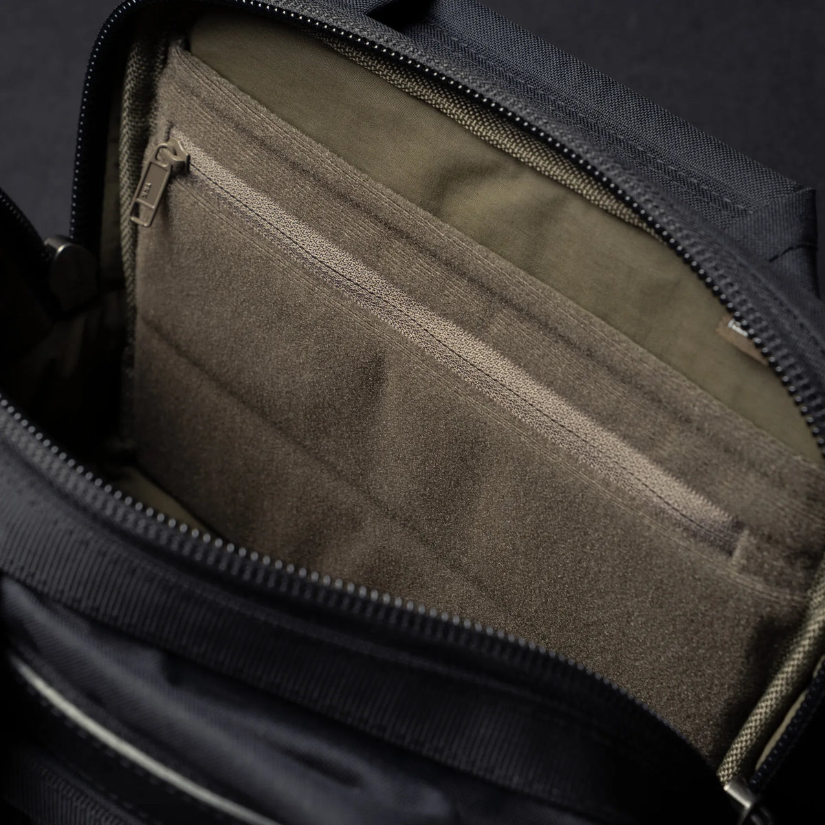 Wotancraft Mini Rider v2 inner zip pocket and olive lining close-up