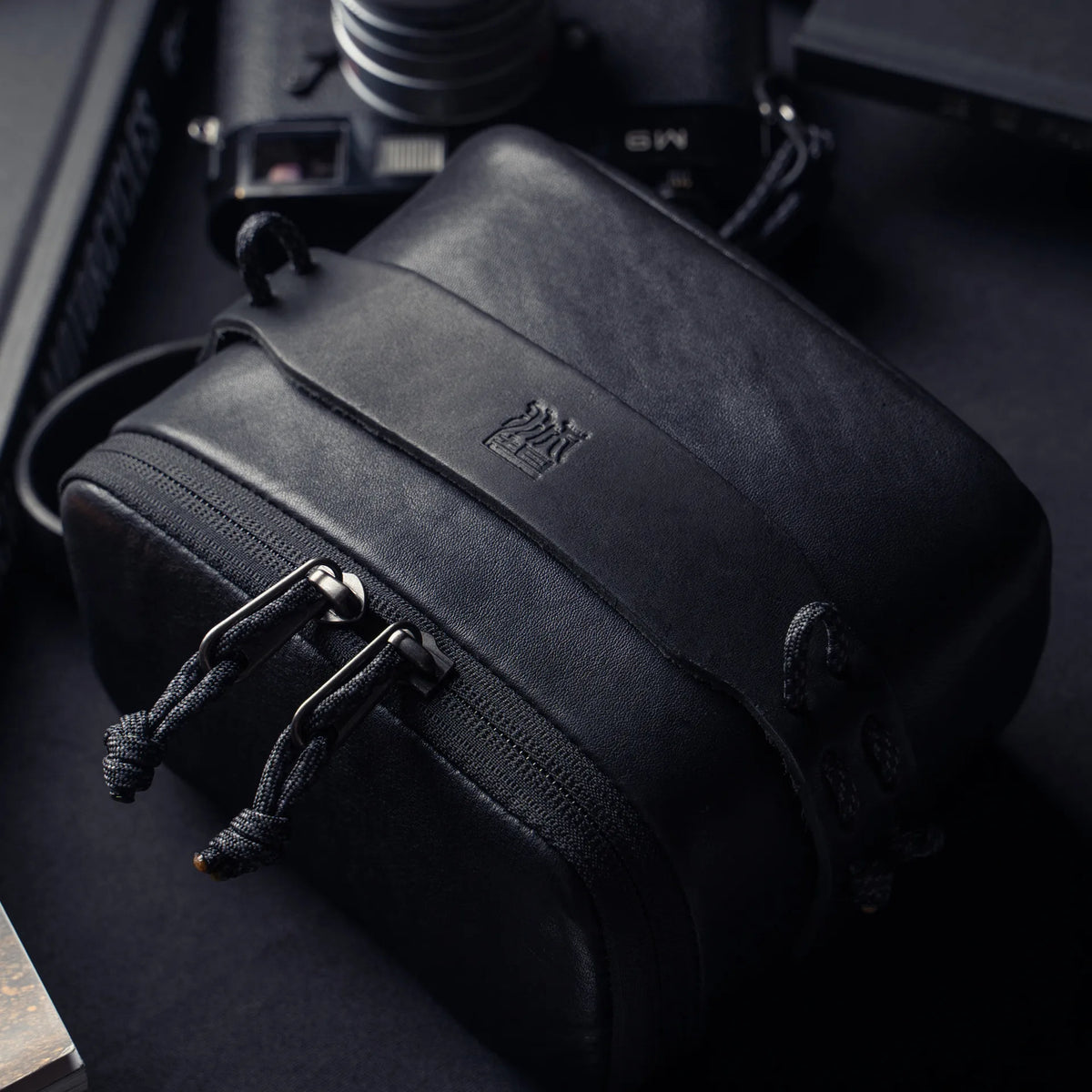 Wotancraft black leather pouch embossed logo and paracord zip pulls