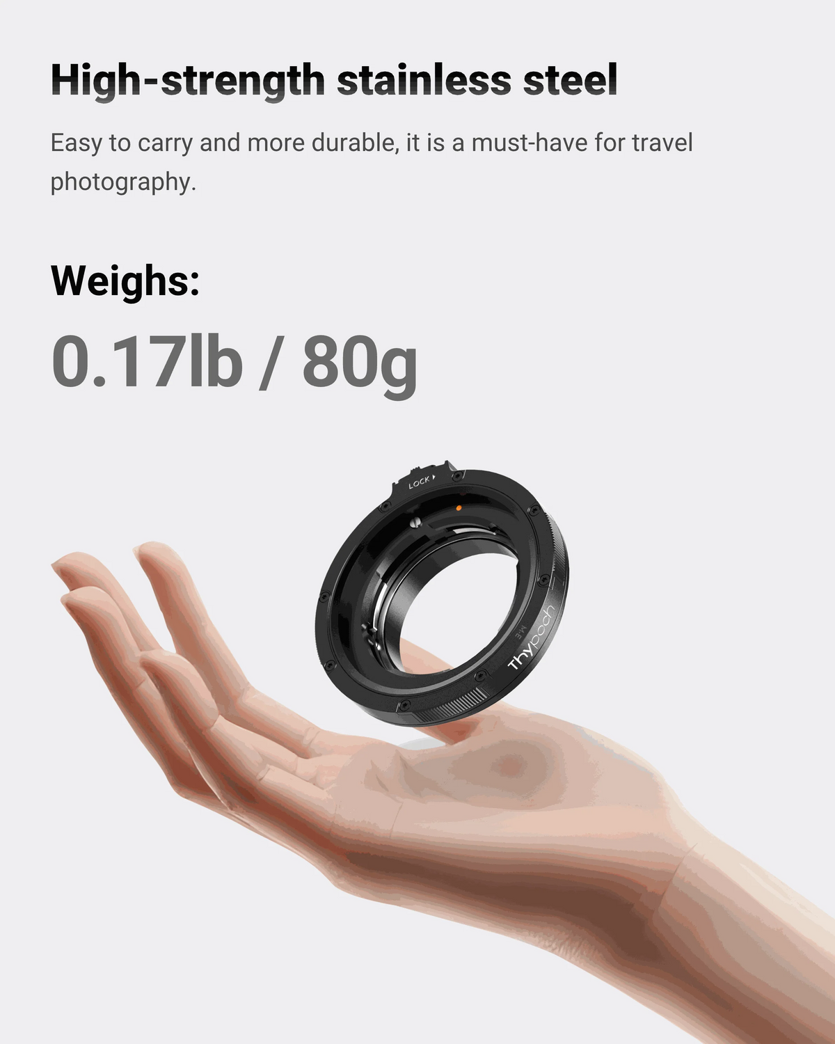 Thypoch stainless steel adapter ring weighing 80g, floating above a hand