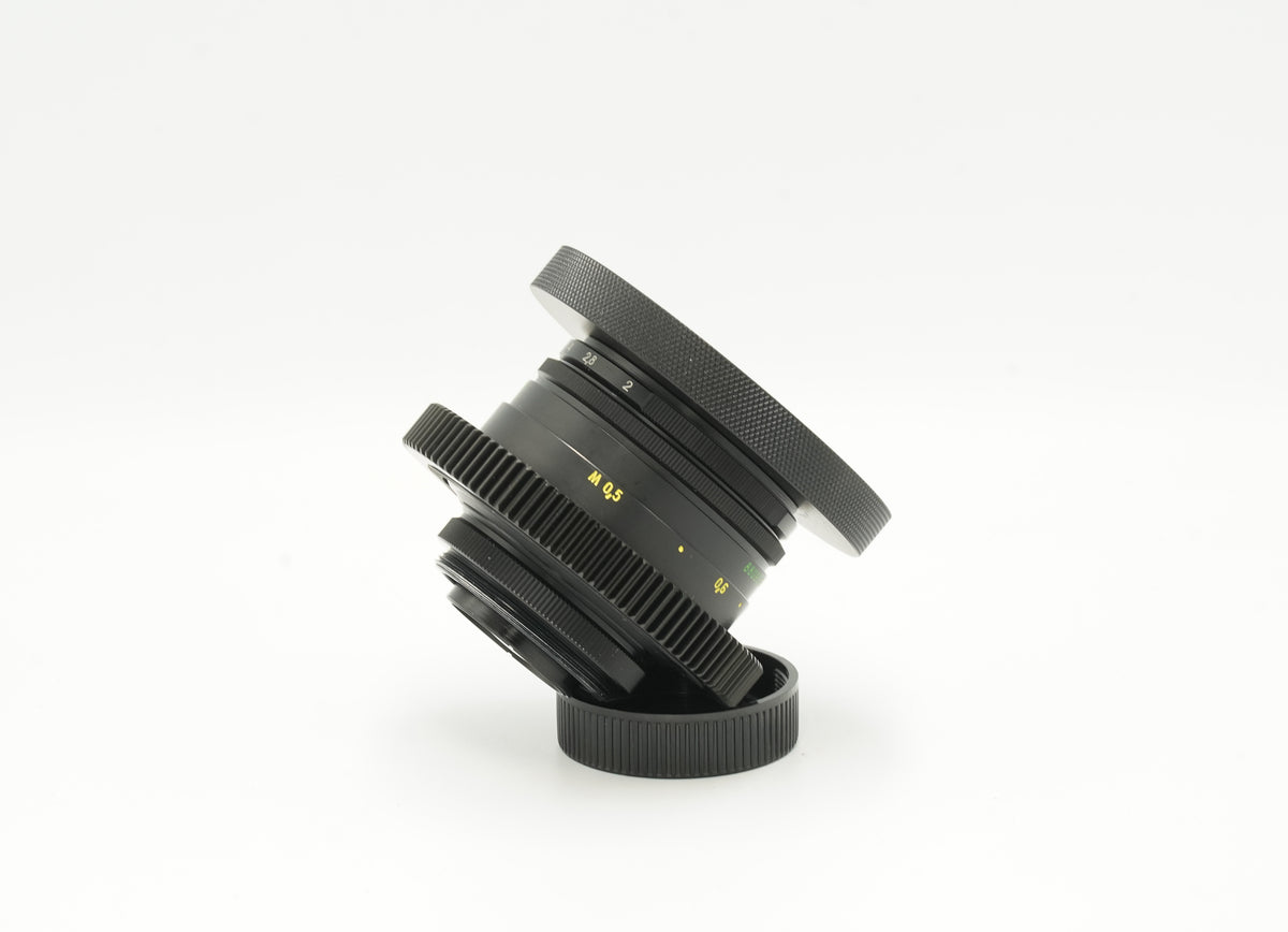 Helios 44-2 cine-modded lens, angled side view with hood and rear cap