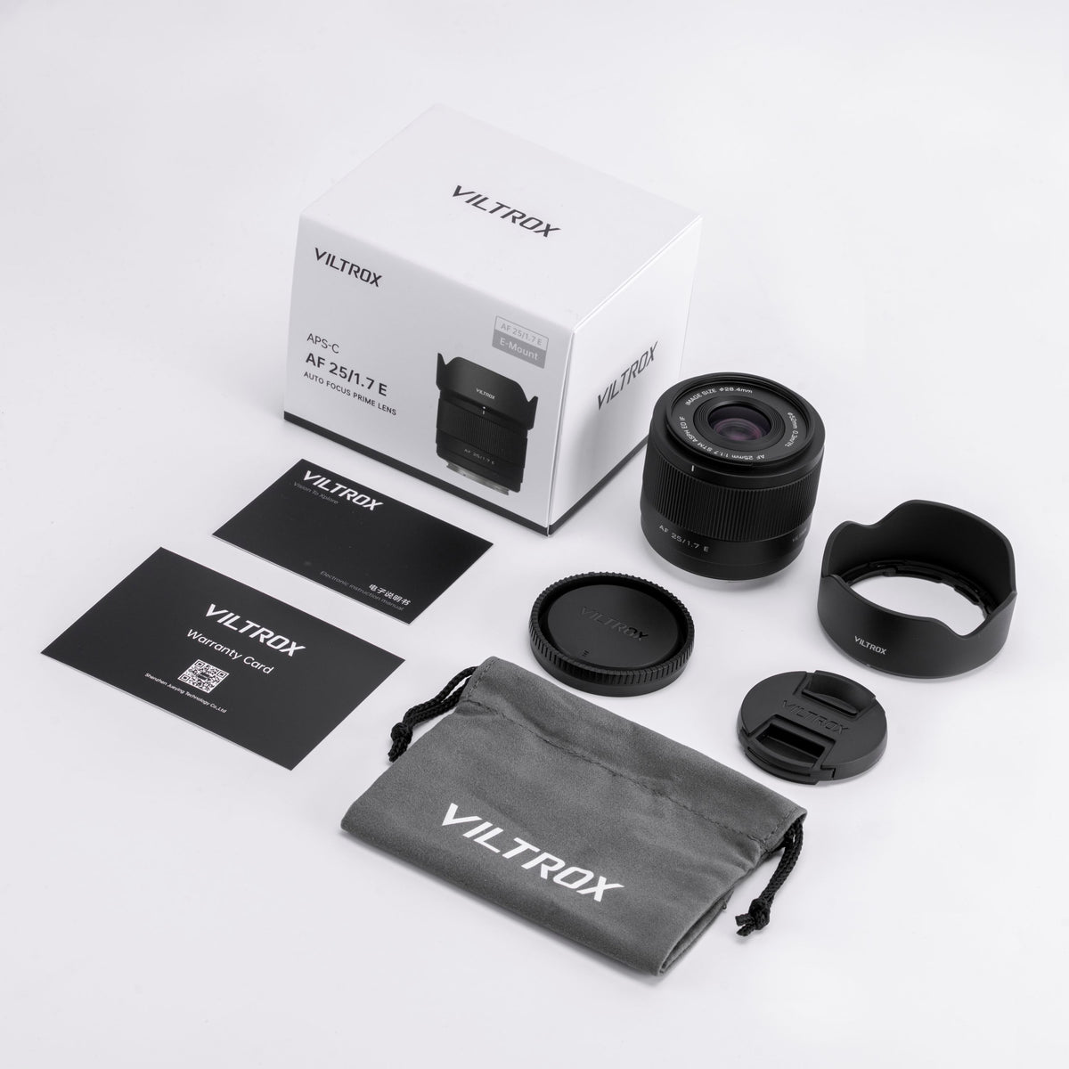 Viltrox AF 25mm f/1.7 E box contents: lens, hood, pouch, caps and cards