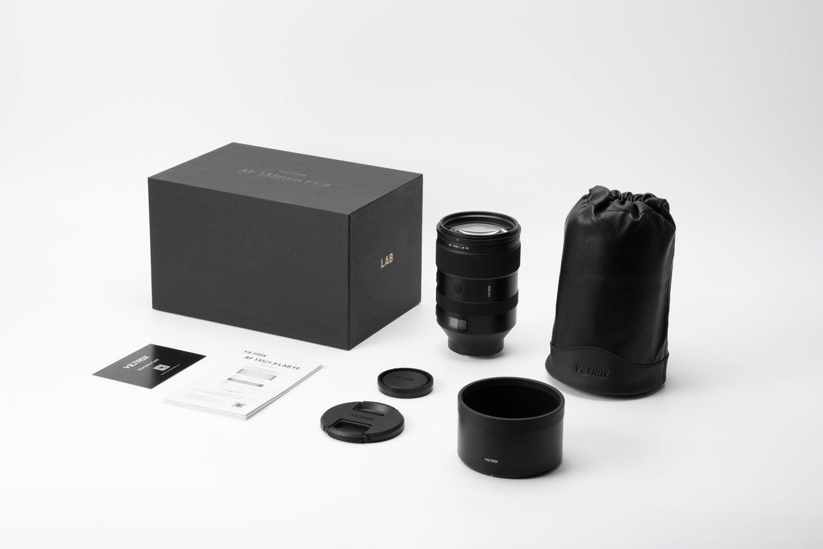Viltrox LAB AF 135mm f/1.8 box contents: lens, hood, leather pouch, caps and manual