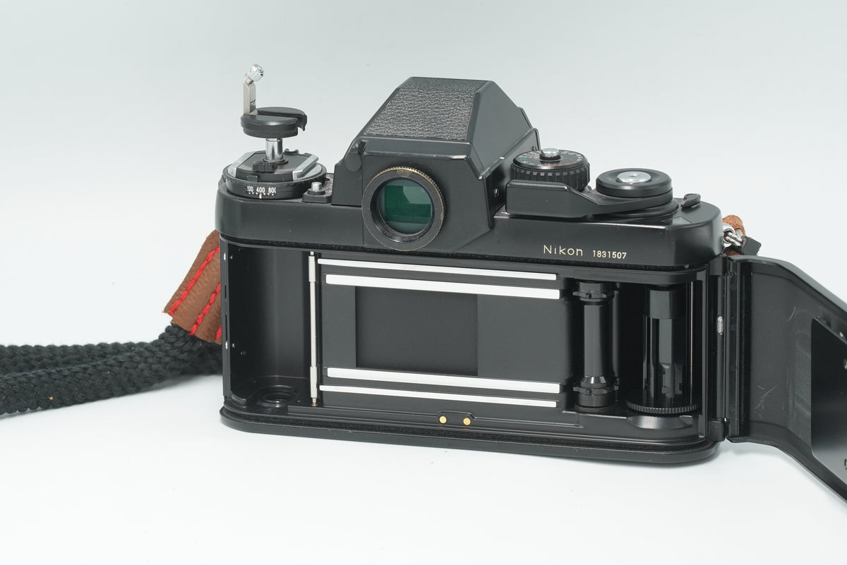 Nikon F3 film camera with the back open, showing the film chamber