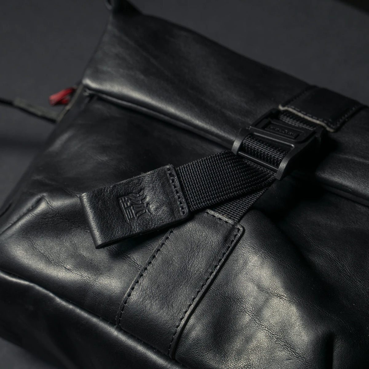 Wotancraft Pilot black leather Fidlock buckle and logo tab close-up