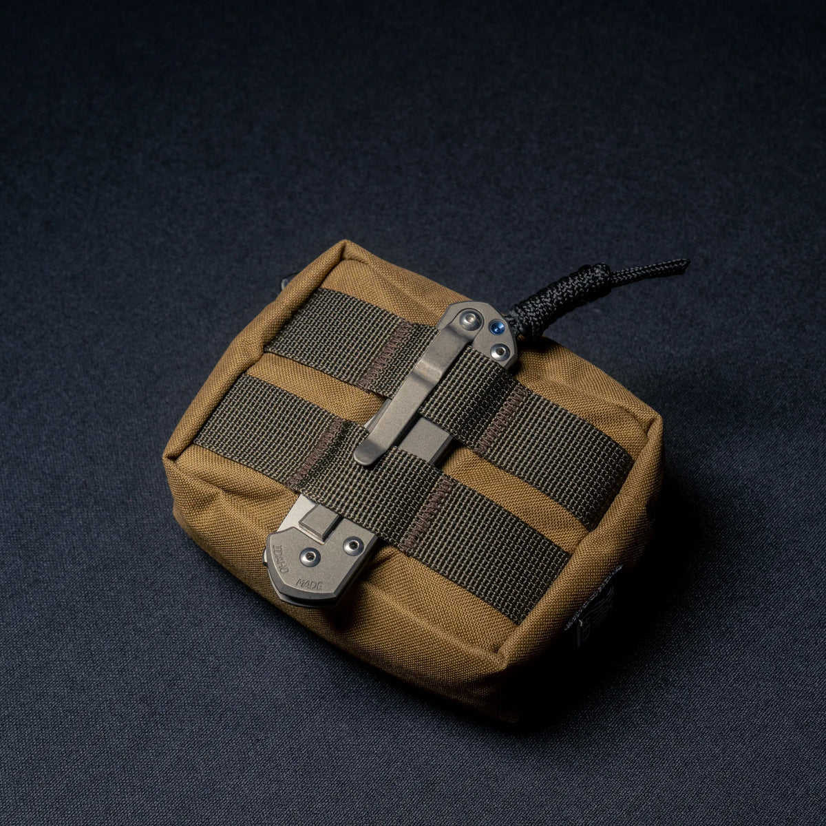 Wotancraft Armor small pocket with a folding knife clipped to the webbing