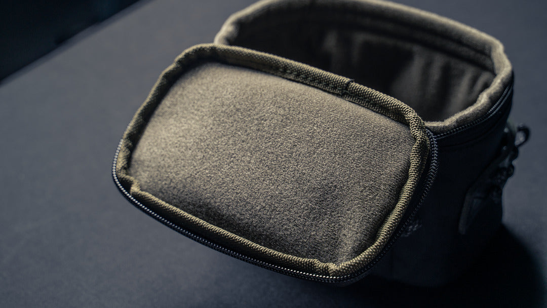Wotancraft camera pouch open, showing the soft olive lining