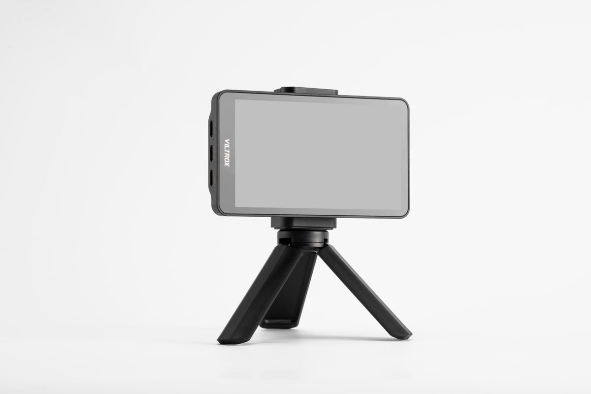 Viltrox DC-T1 monitor on a mini tripod on a grey background