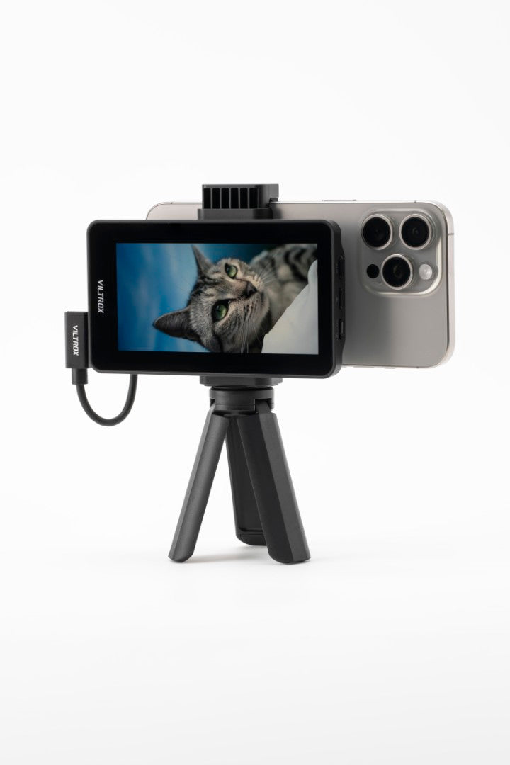 Viltrox DC-T1 showing an iPhone camera feed of a cat, on a mini tripod