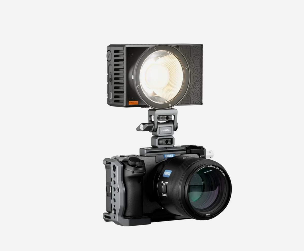 Sirui C60X pocket light mounted on top of a caged mirrorless camera