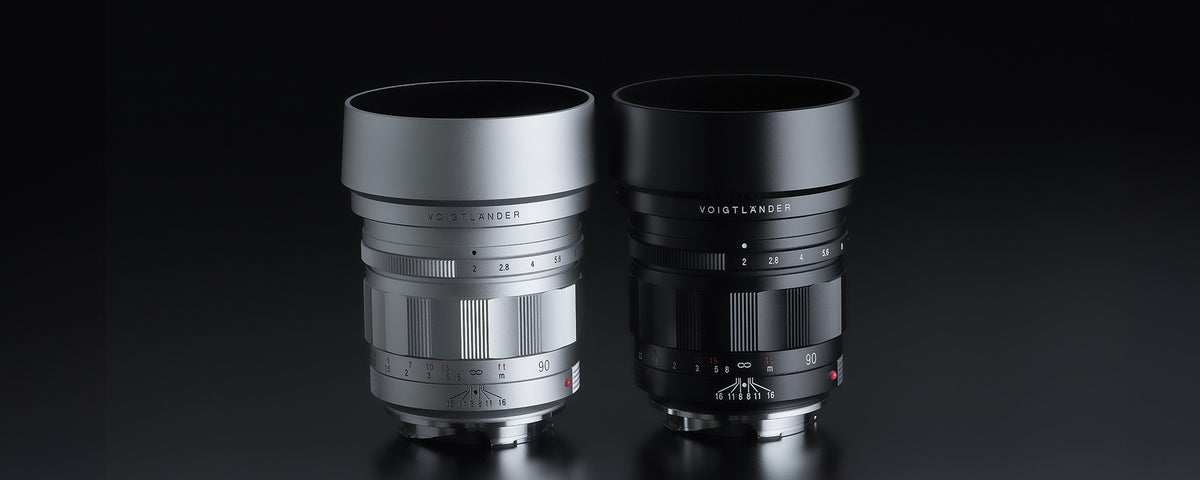 Voigtlander APO-Ultron 90mm f/2 VM lenses in silver and black with hoods