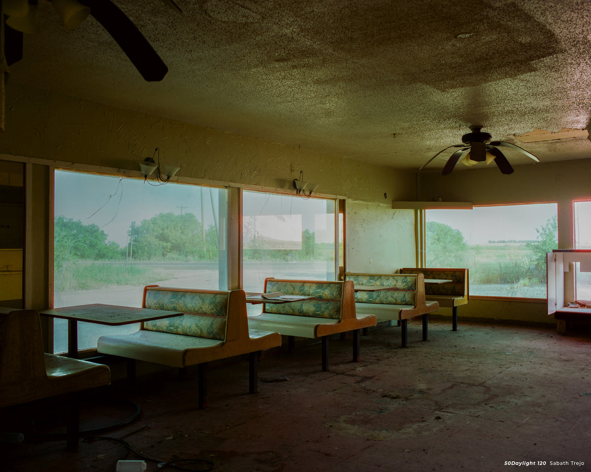 Abandoned diner booths by large windows, sample shot on CineStill 50D 120