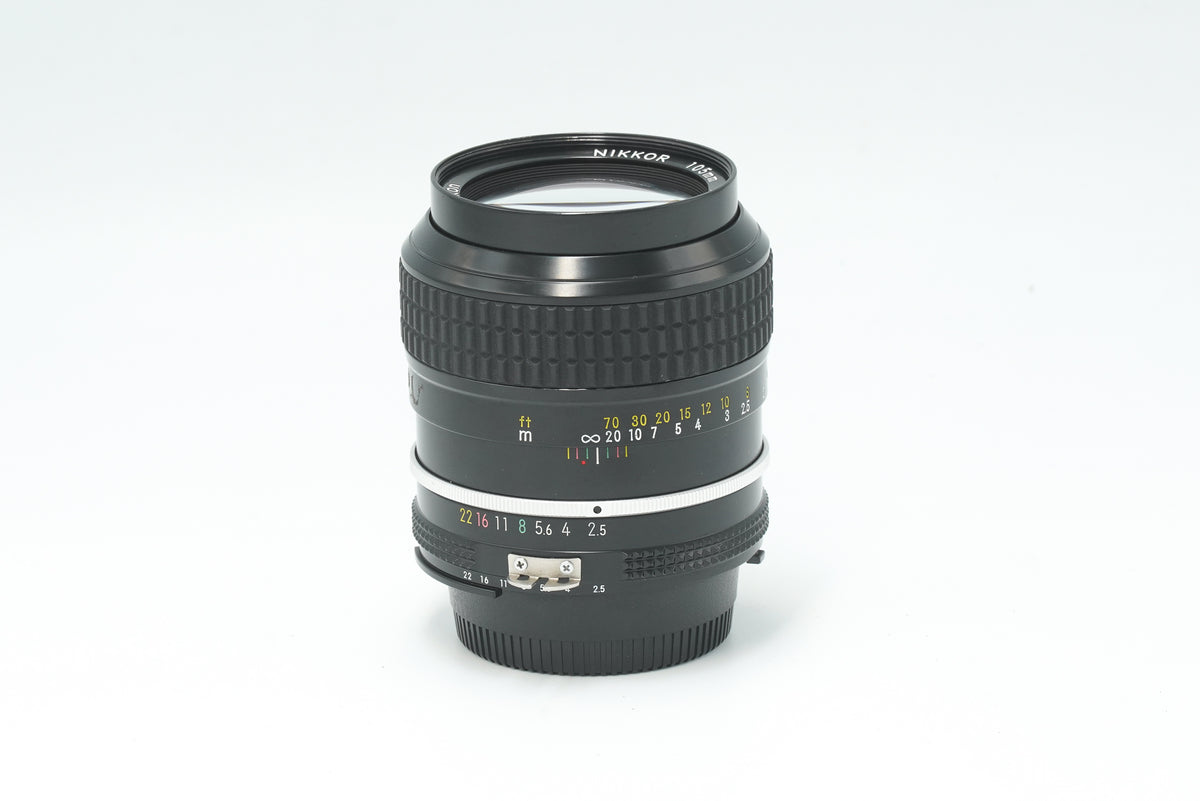Nikon Nikkor 105mm f/2.5 Ai portrait lens, side view with focus scale