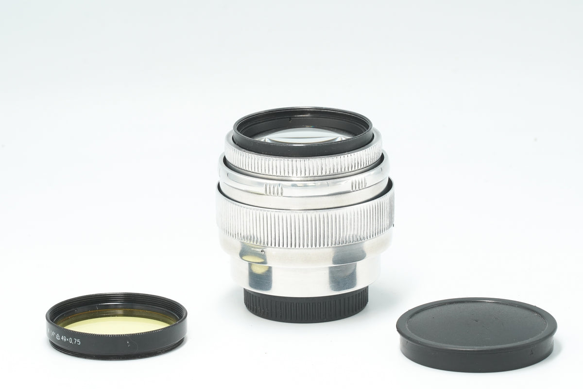 Jupiter-9 85mm f/2 silver lens with yellow filter, cap and rear cap