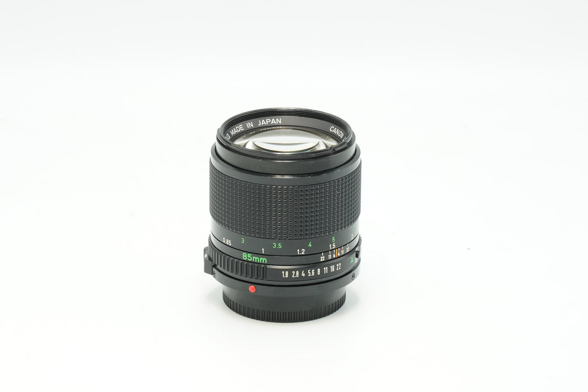 Canon New FD 85mm f/1.8 portrait lens, side view with focus scale