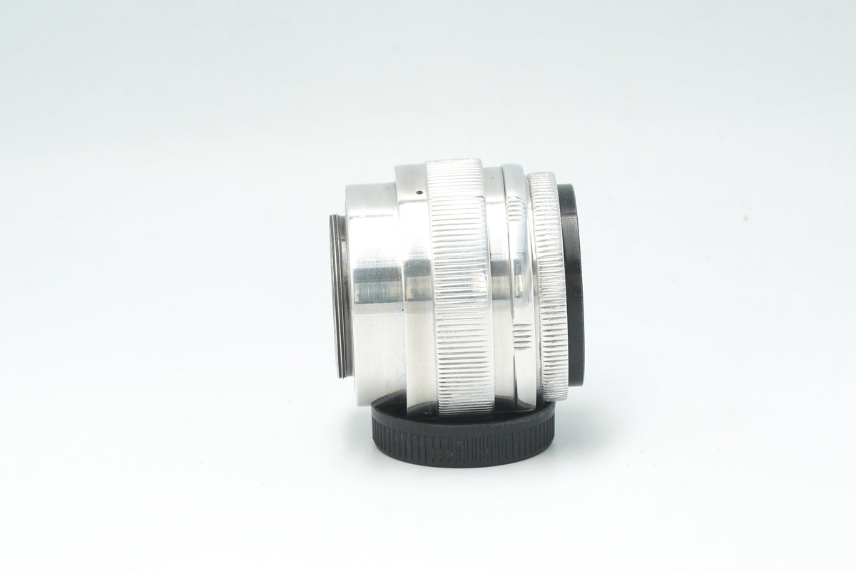 Jupiter-9 85mm f/2 silver, side view of the ribbed aluminium barrel