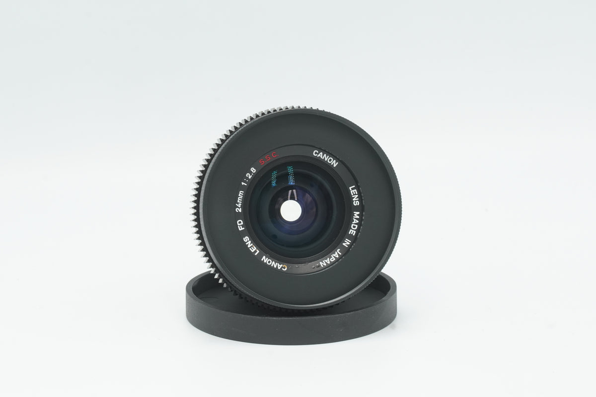 Canon FD 24mm f/2.8 S.S.C. cine mod, front view with focus gear