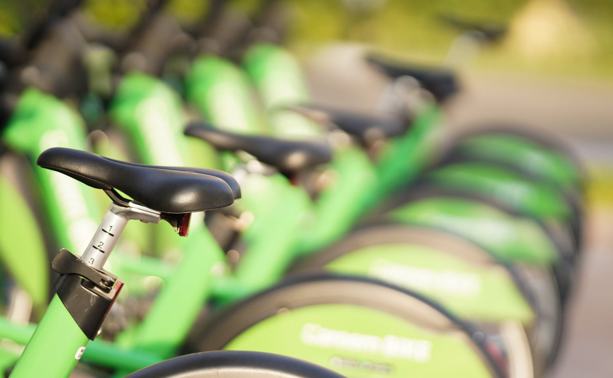 Row of green rental bicycles with shallow focus, Canon nFD 85mm f/1.8 sample