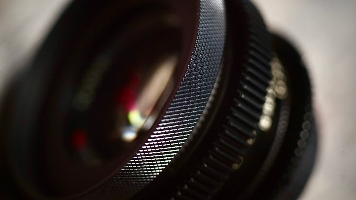 SIMMOD front cine ring fitted to a lens with follow focus gear, close-up
