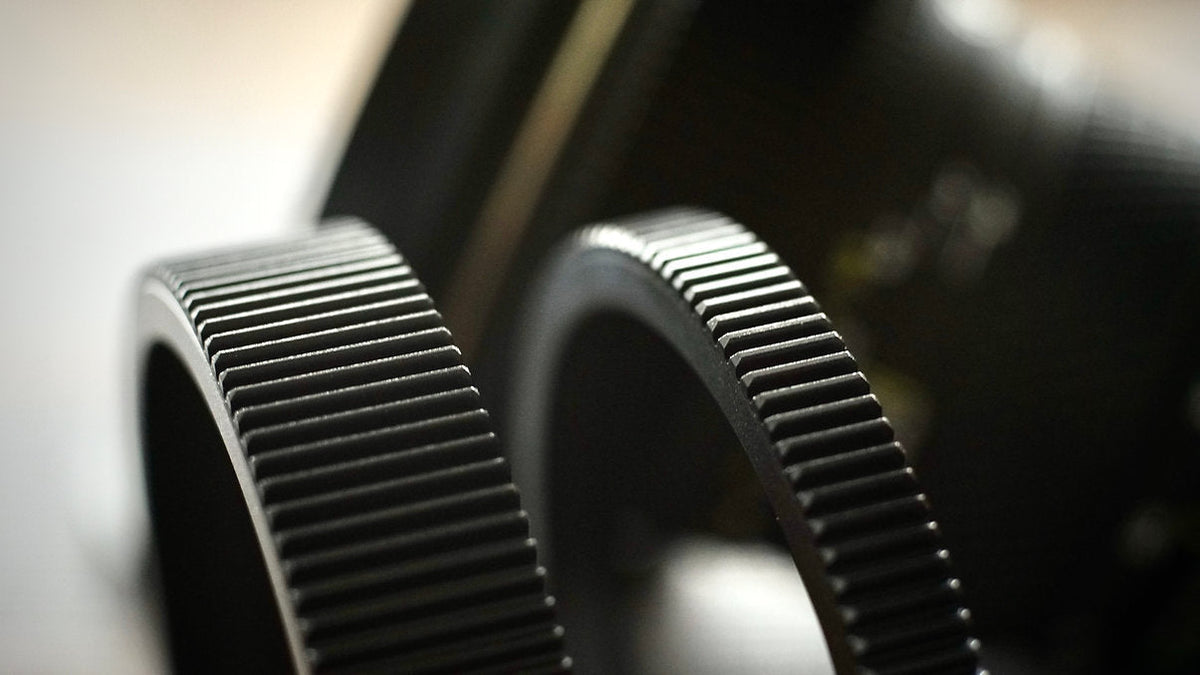 Two SIMMOD follow focus gears side by side, close-up