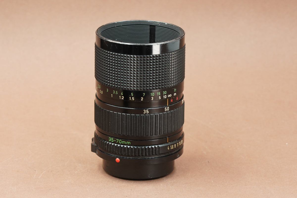 Canon New FD 35-70mm f/4 zoom lens, side view with focus and zoom scales
