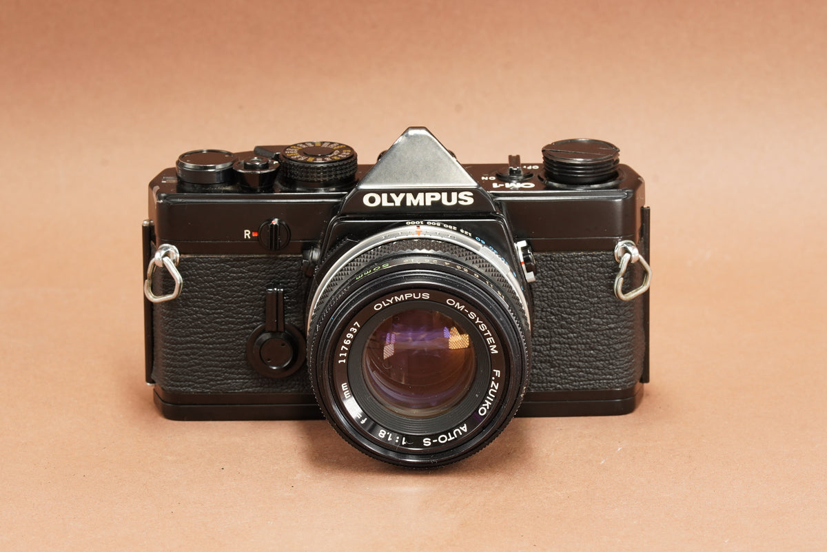 Olympus OM-1 black 35mm SLR with Zuiko Auto-S 50mm f/1.8, front view