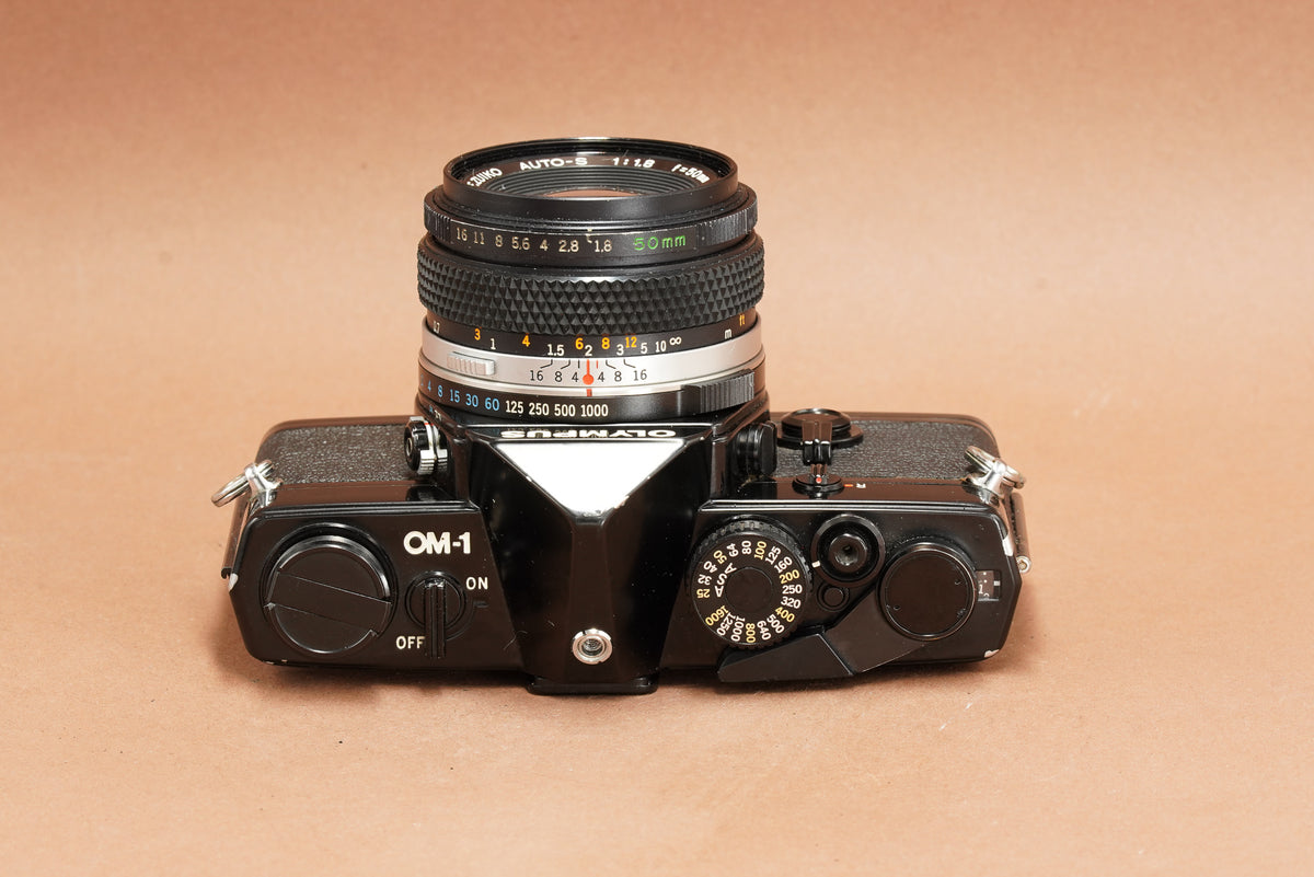 Olympus OM-1 black SLR top plate with film rewind and ON/OFF switch