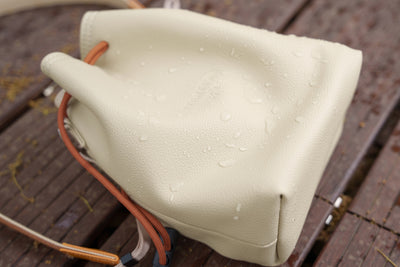 Water droplets on the TTArtisan cream drawstring bag, water-resistant leather