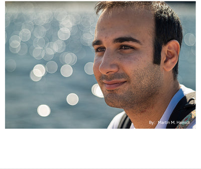 Portrait of a man with sparkling water bokeh, TTArtisan 100mm f/2.8 sample
