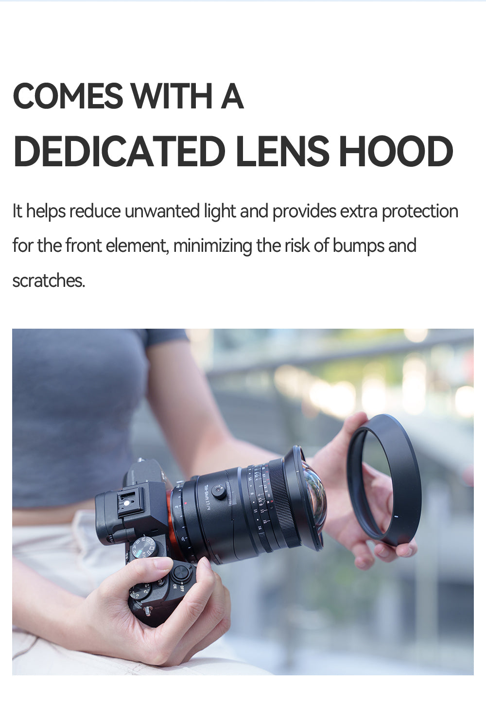 Woman holding a Sony camera with the TTArtisan 17mm tilt-shift and its lens hood