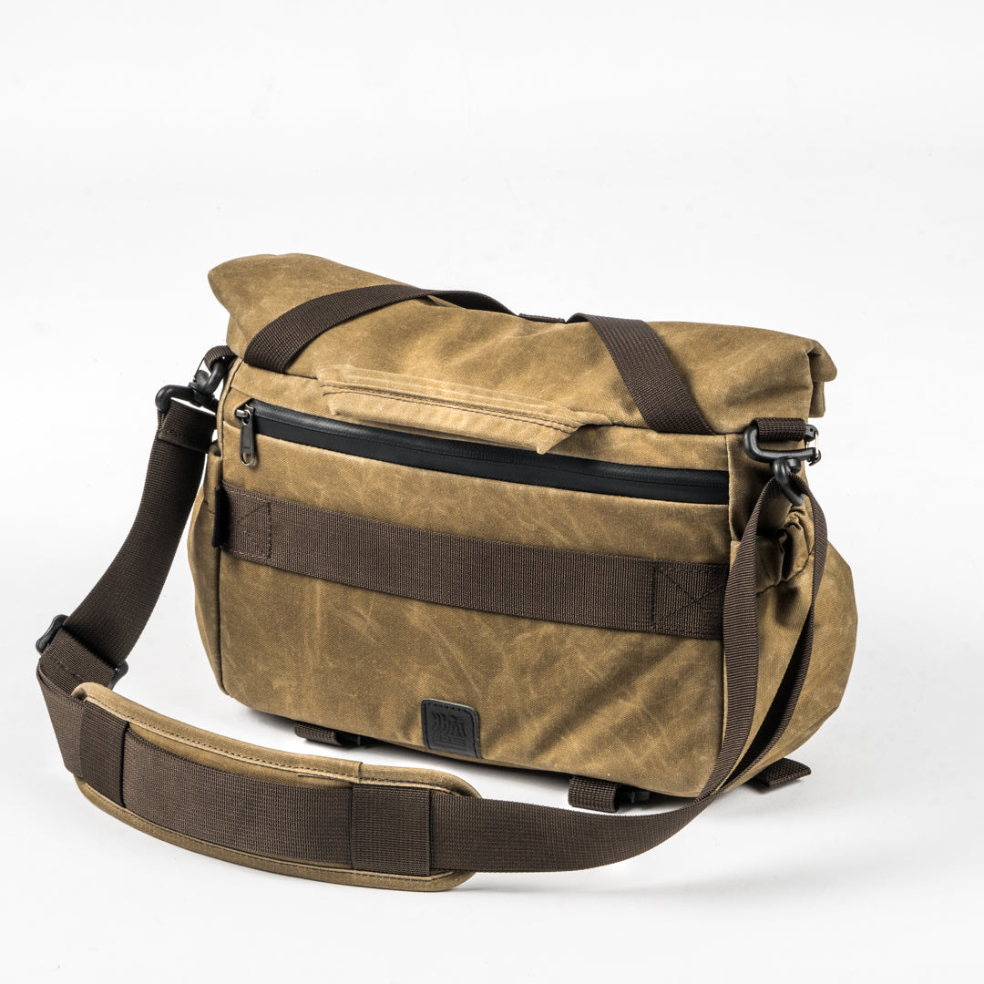 Wotancraft Pilot 7L khaki camera bag, rear view with zip pocket and shoulder strap