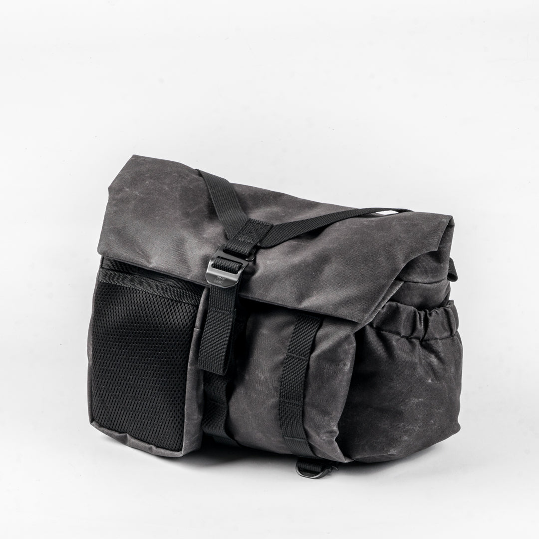 Wotancraft Pilot 7L charcoal bag with mesh side pocket, angled view