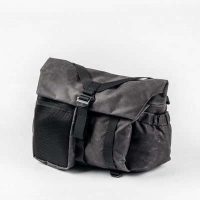 Wotancraft Pilot 7L charcoal bag with mesh side pocket, angled view