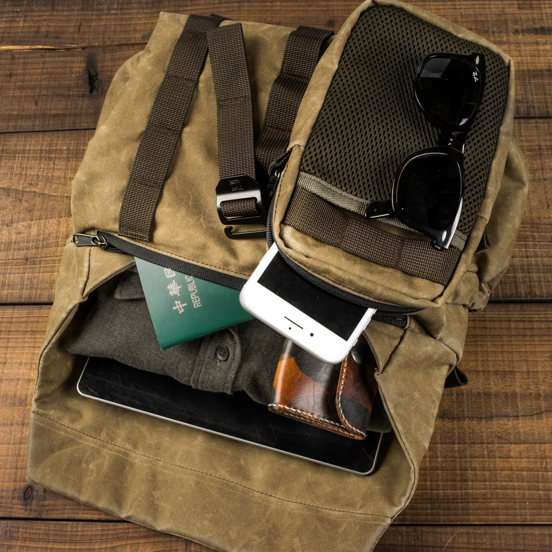 Wotancraft Pilot 7L front pocket with passport, phone, sunglasses and wallet