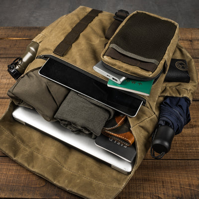 Wotancraft Pilot 10L khaki bag packed with tablet, laptop, clothes and umbrella