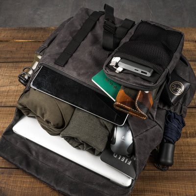 Wotancraft Pilot 10L charcoal bag packed with tablet, laptop, clothes and umbrella