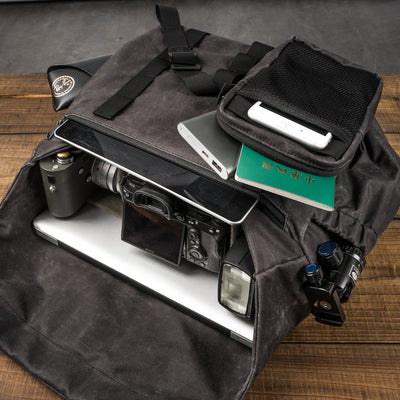 Wotancraft Pilot 10L charcoal bag packed with Sony camera, flash, tablet and passport