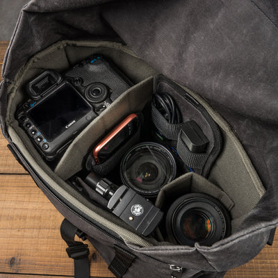 Wotancraft Pilot 10L charcoal bag open with Canon DSLR and lenses in the insert