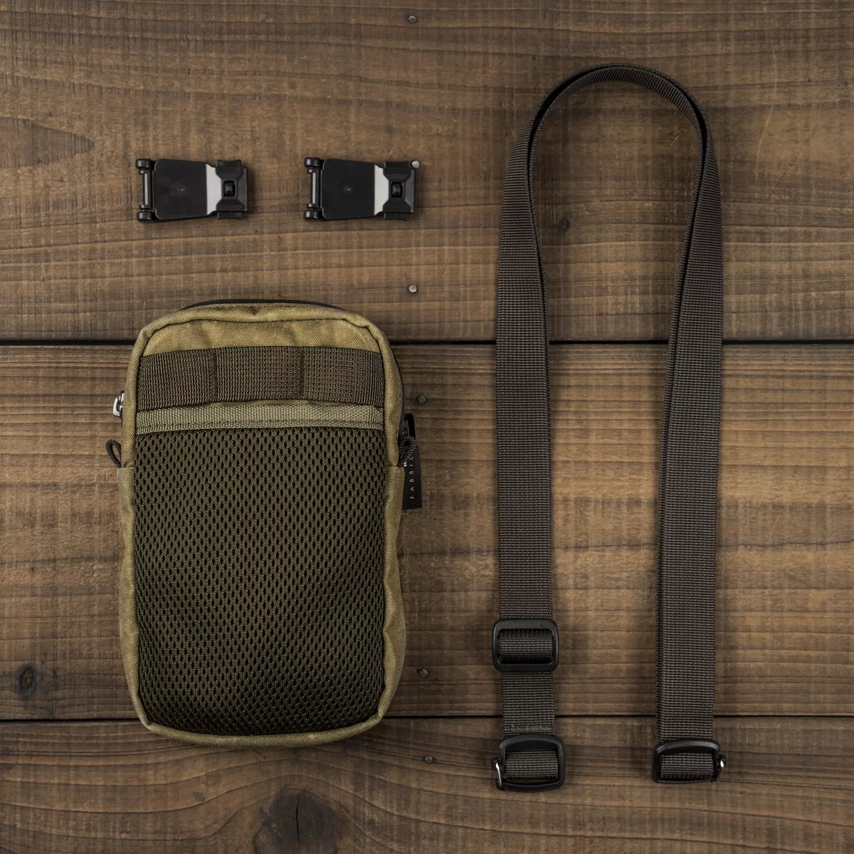 Wotancraft Armor 9 khaki pouch laid out with strap and two clip mounts
