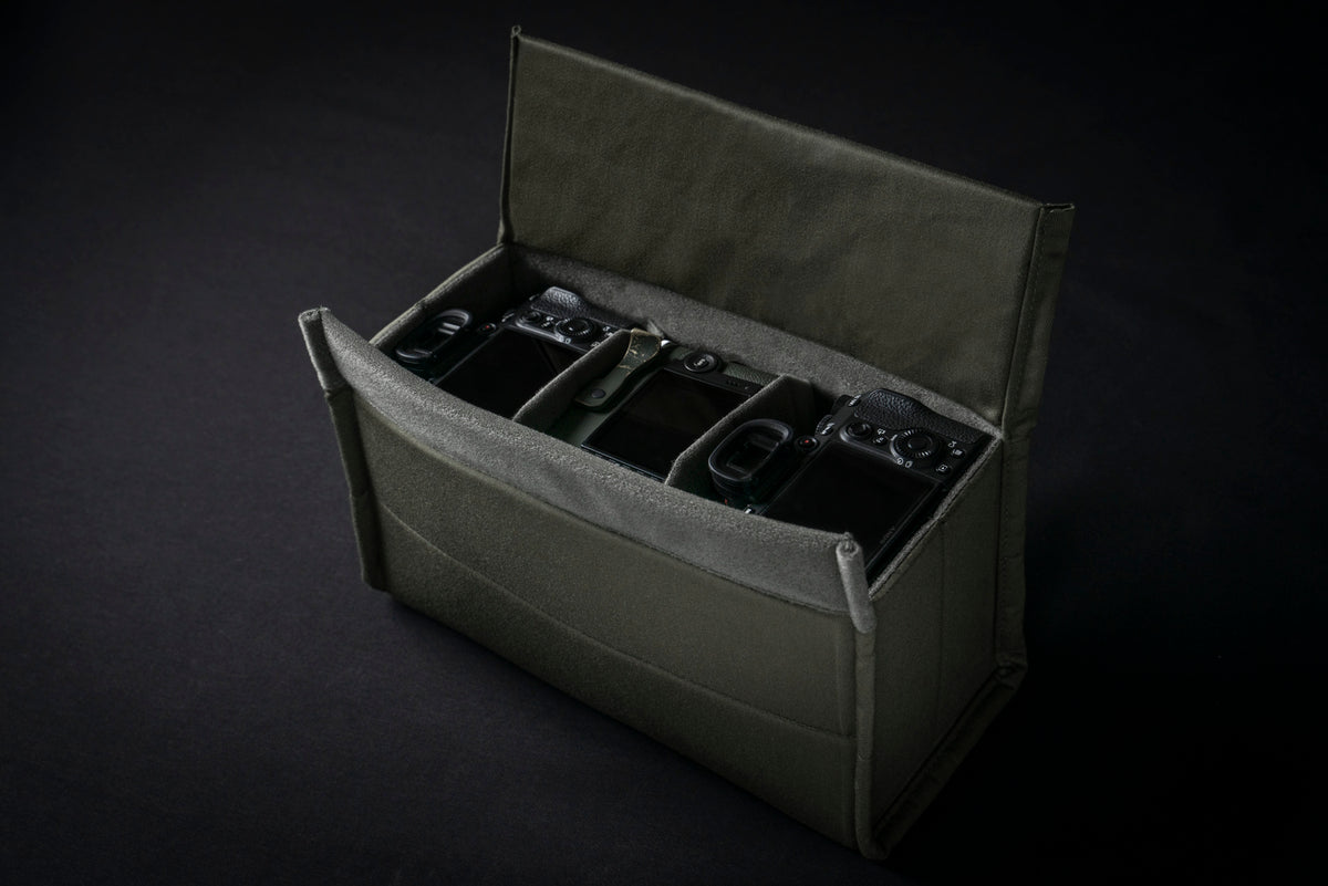 Wotancraft camera insert open with three camera bodies in compartments