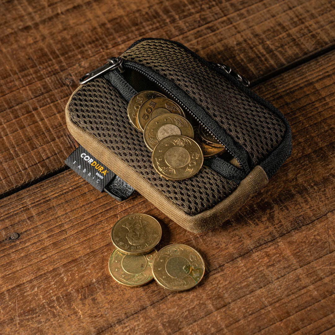 Wotancraft mesh coin pouch open with coins spilling out