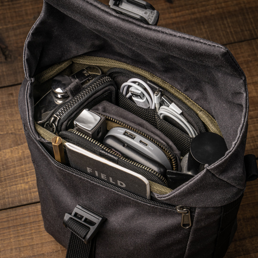 Wotancraft Pilot 3.5L black bag packed with everyday carry, from above