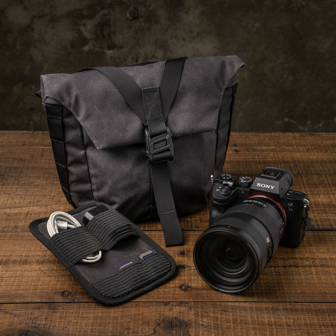 Wotancraft Pilot 3.5L black bag with organiser and Sony A7 camera beside it